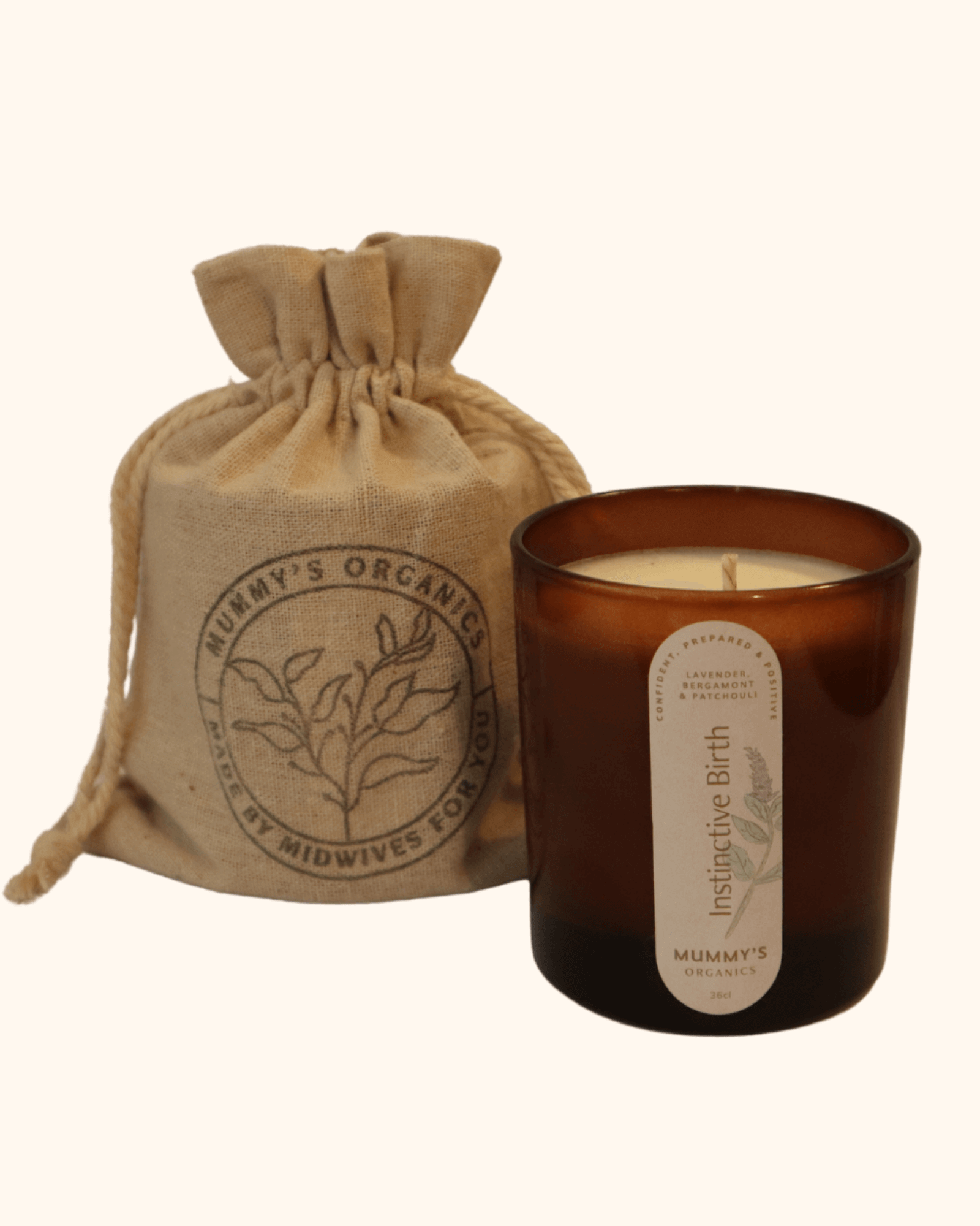 Photo of Mummy&#39;s Organics Instinctive Birth Candle from the front standing next to cotton bag