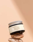 Photo of Mummy's Organics Organic Scar Balm from the front on top of a prop